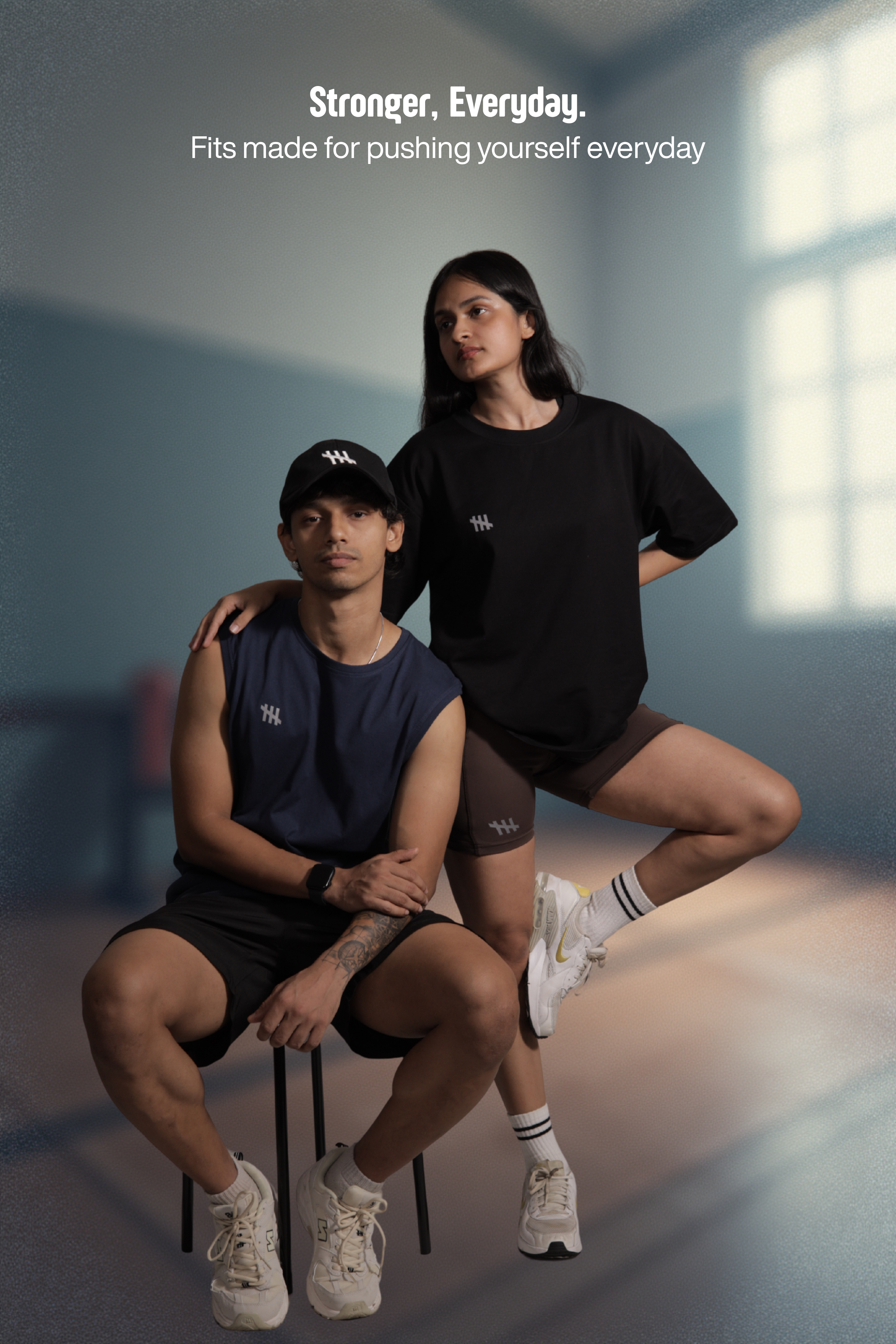 Two people wearing athletic clothing with a focus on fitness and motivation.
