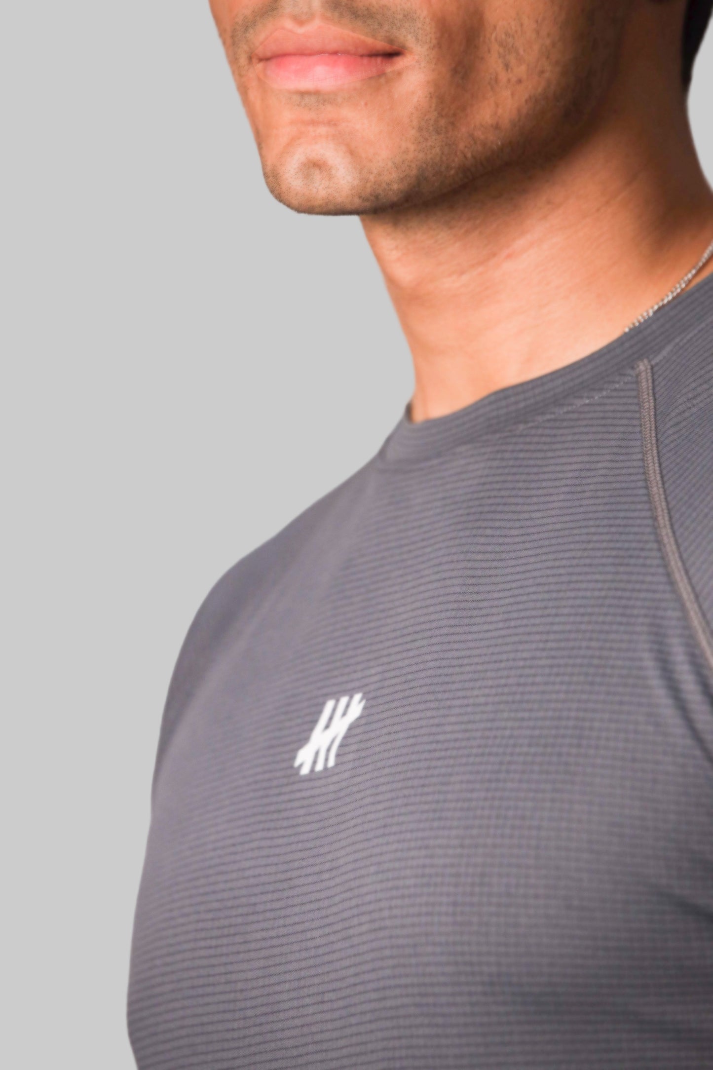 tmr-motion-grid-tee-graphite-badge