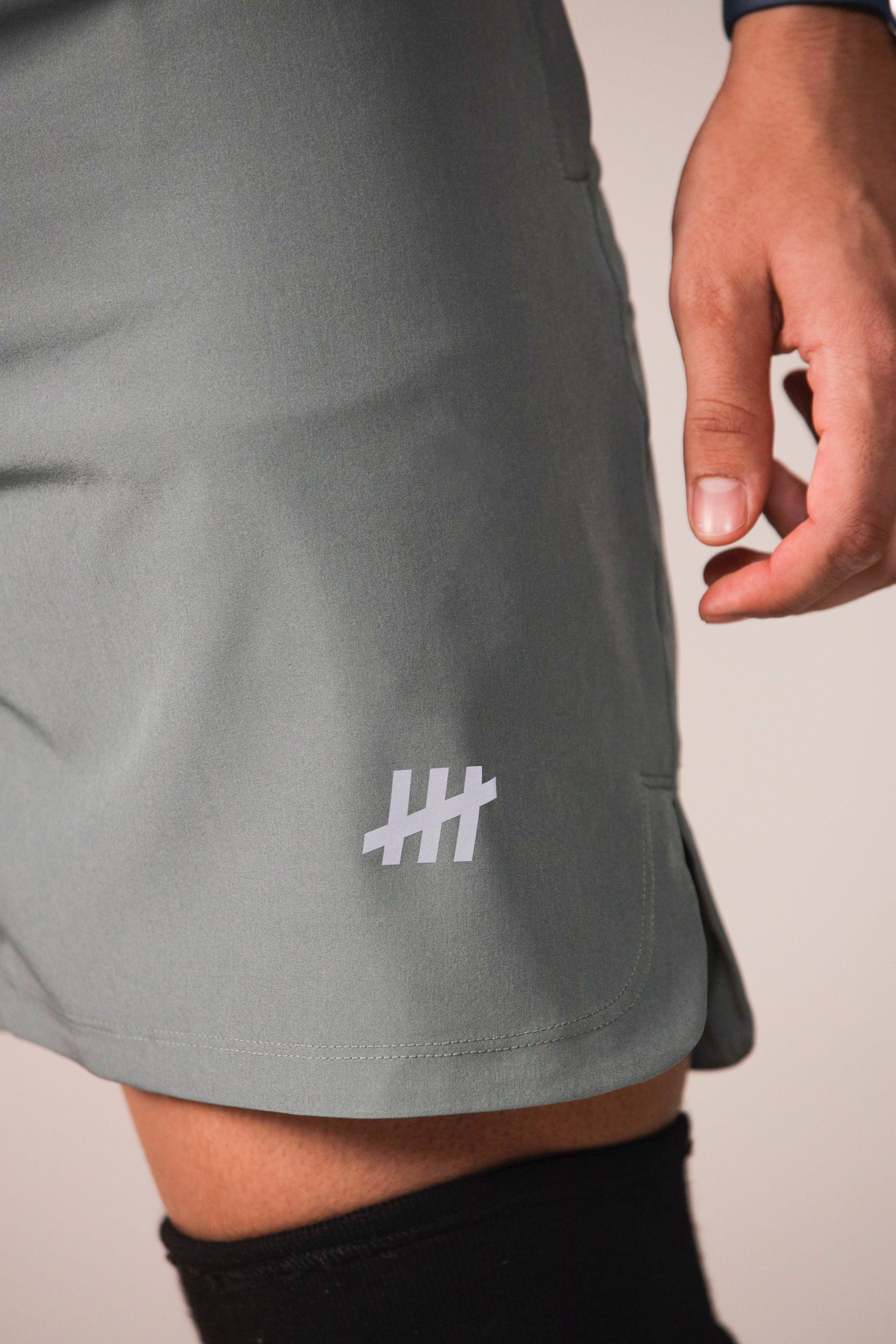 tmr-training-shorts-green-badge